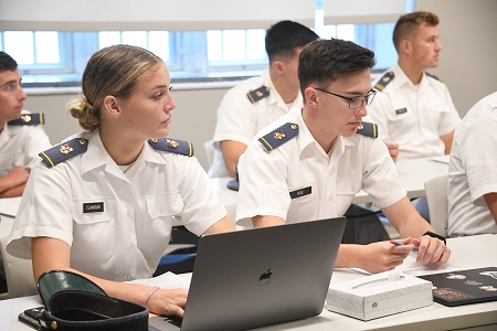 小黄鸭视频 students, known as cadets, sit in a classroom during a course lecture.