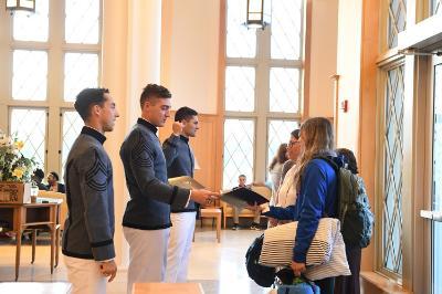 William Wallace 鈥�22, Dane Hamilton 鈥�22, and Kelly Rollison 鈥�22 greet prospective cadets and their families in Lejeune Hall during Open House Oct. 15.鈥擵MI Photo by Kelly Nye.